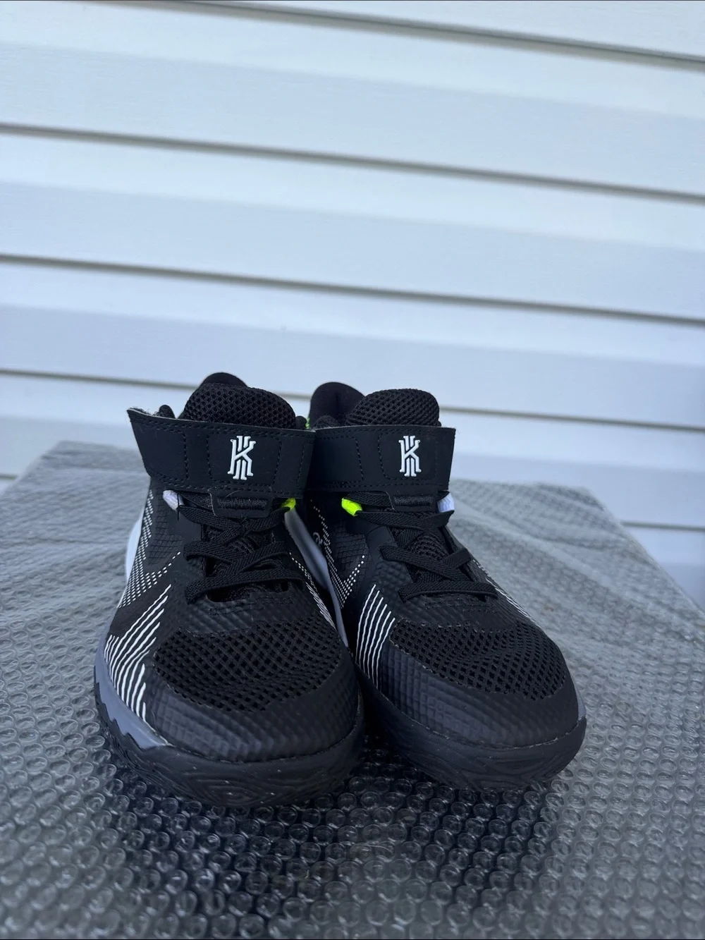 Nike Kids Black and White High-Top Sneakers with Neon Accent
